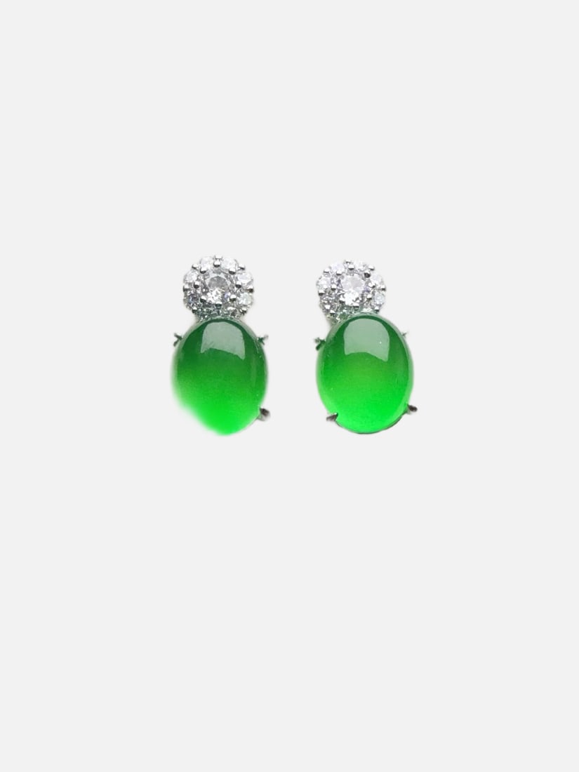 High-quality, icy green jadeite earrings: These jadeite earrings are of exceptional quality, with a fine texture, delicate and three-dimensional design, and are completely free of cracks. Provenance:Private Estate, San Diego, California. Our