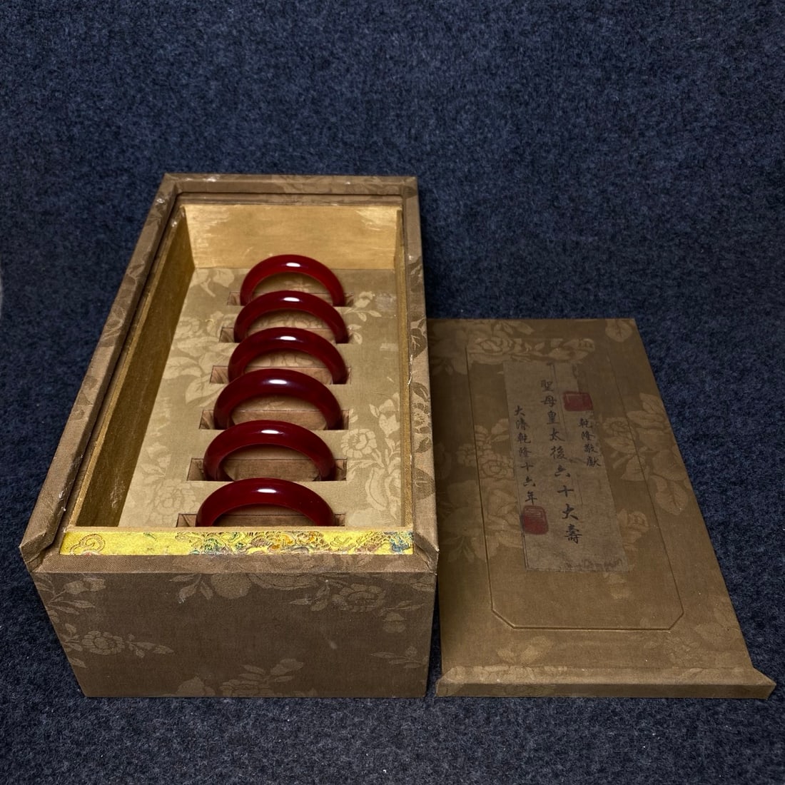 A precious high-ice jadeite bangle from the collection box of imperial bangles from the Qianlong: A precious high-ice jadeite bangle from the collection box of imperial bangles from the Qianlong Emperor's court. Provenance:Private collection, Quincy, Massachusetts. Our dedicated team expertly hand