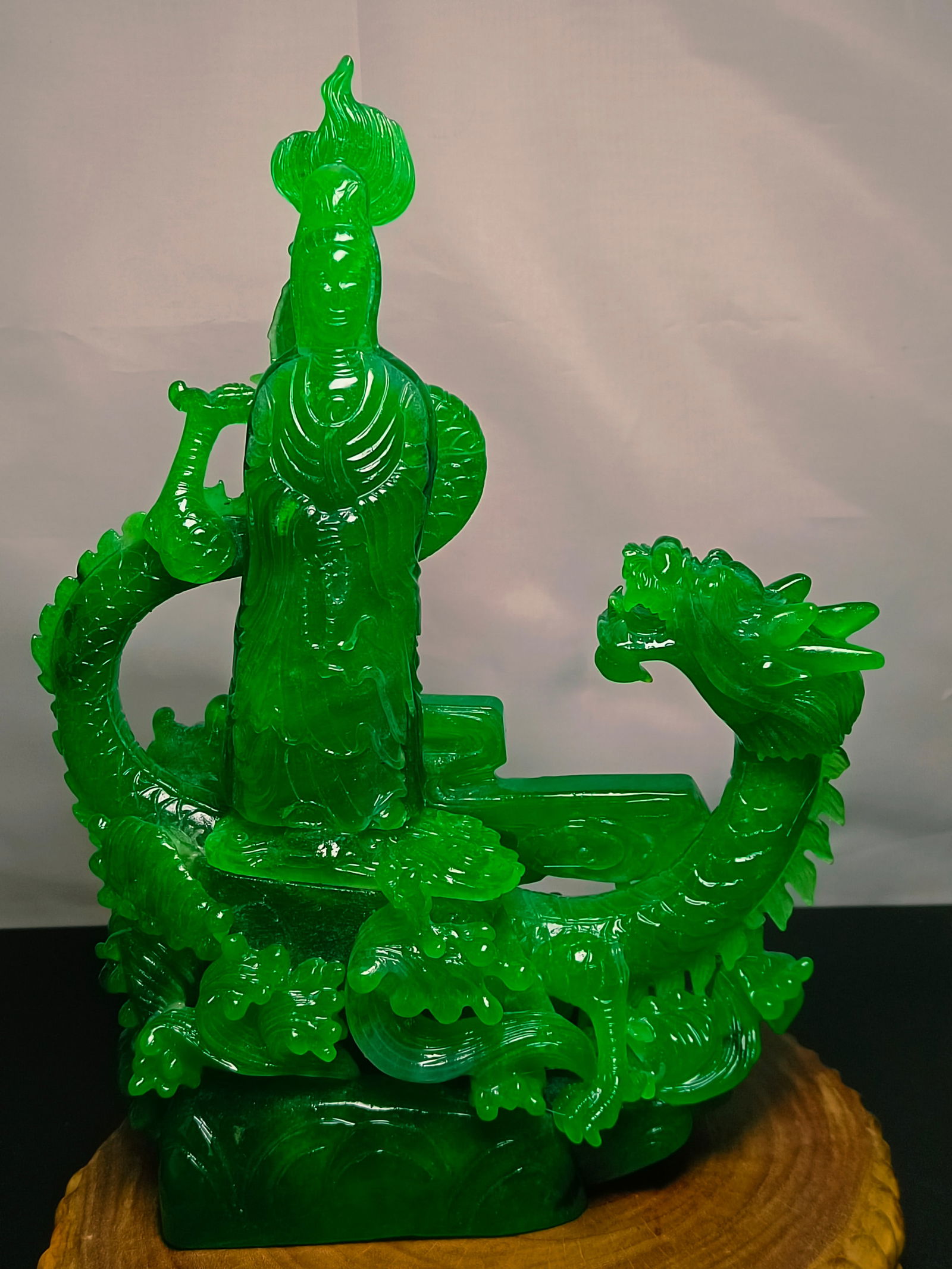 Dragon Stone Type Imperial Green Jadeite Guanyin Riding a Dragon Ornament: Dragon Stone Type Imperial Green Jadeite Guanyin Riding a Dragon Ornament Provenance:Private collection, Cliffside Park, New Jersey. Our dedicated team expertly handles both domestic and global shippi