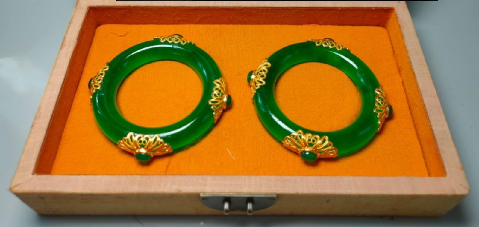 Old-fashioned embroidered box containing a gold-inlaid jade bracelet (1 of 9)