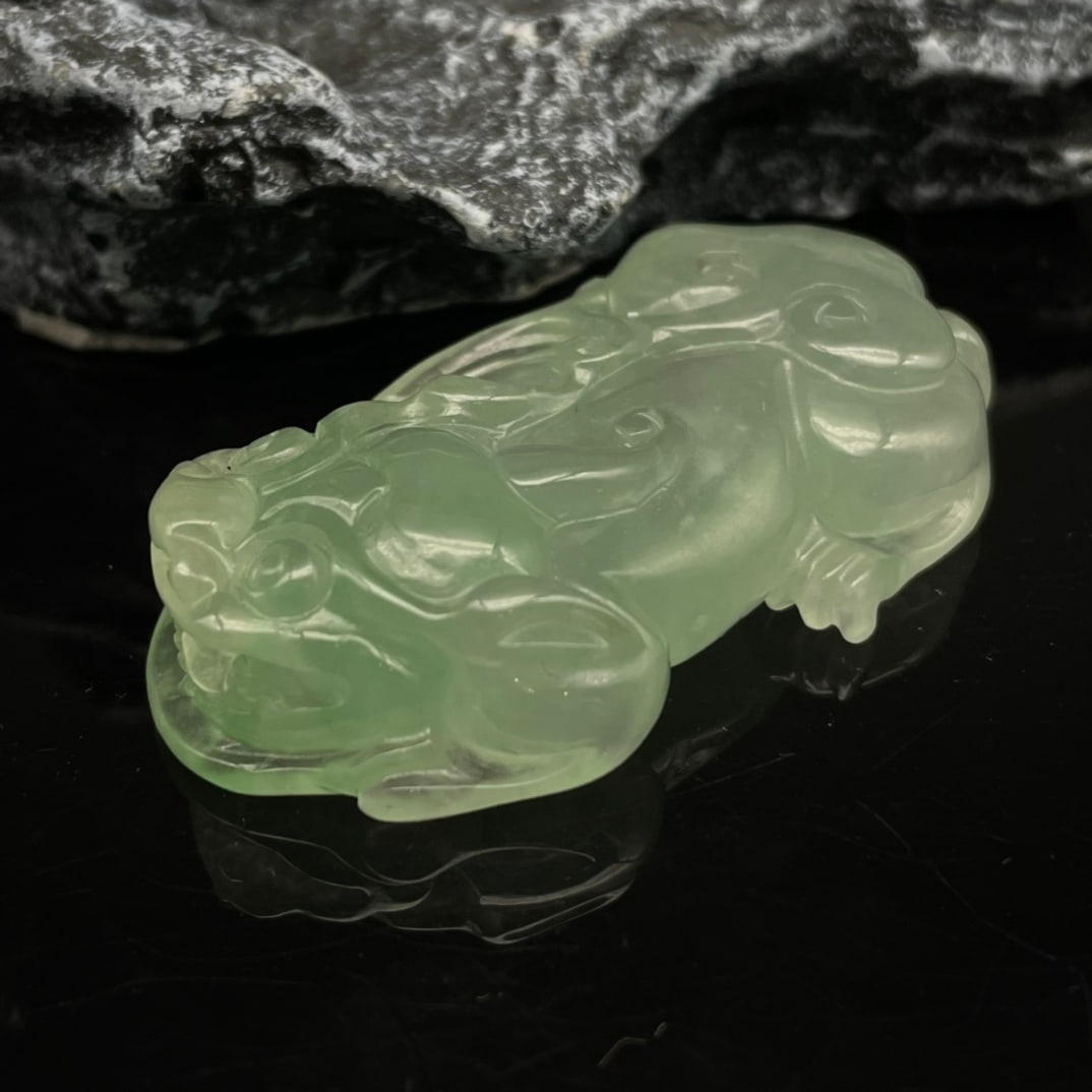 High-quality, finely crafted jadeite [Pixiu]: High-quality, finely crafted jadeite [Pixiu] with excellent translucency, fine and pure texture, flawless, moist, icy, and evenly colored. Provenance:Private Estate, Honolulu, Hawaii. Our dedicated te