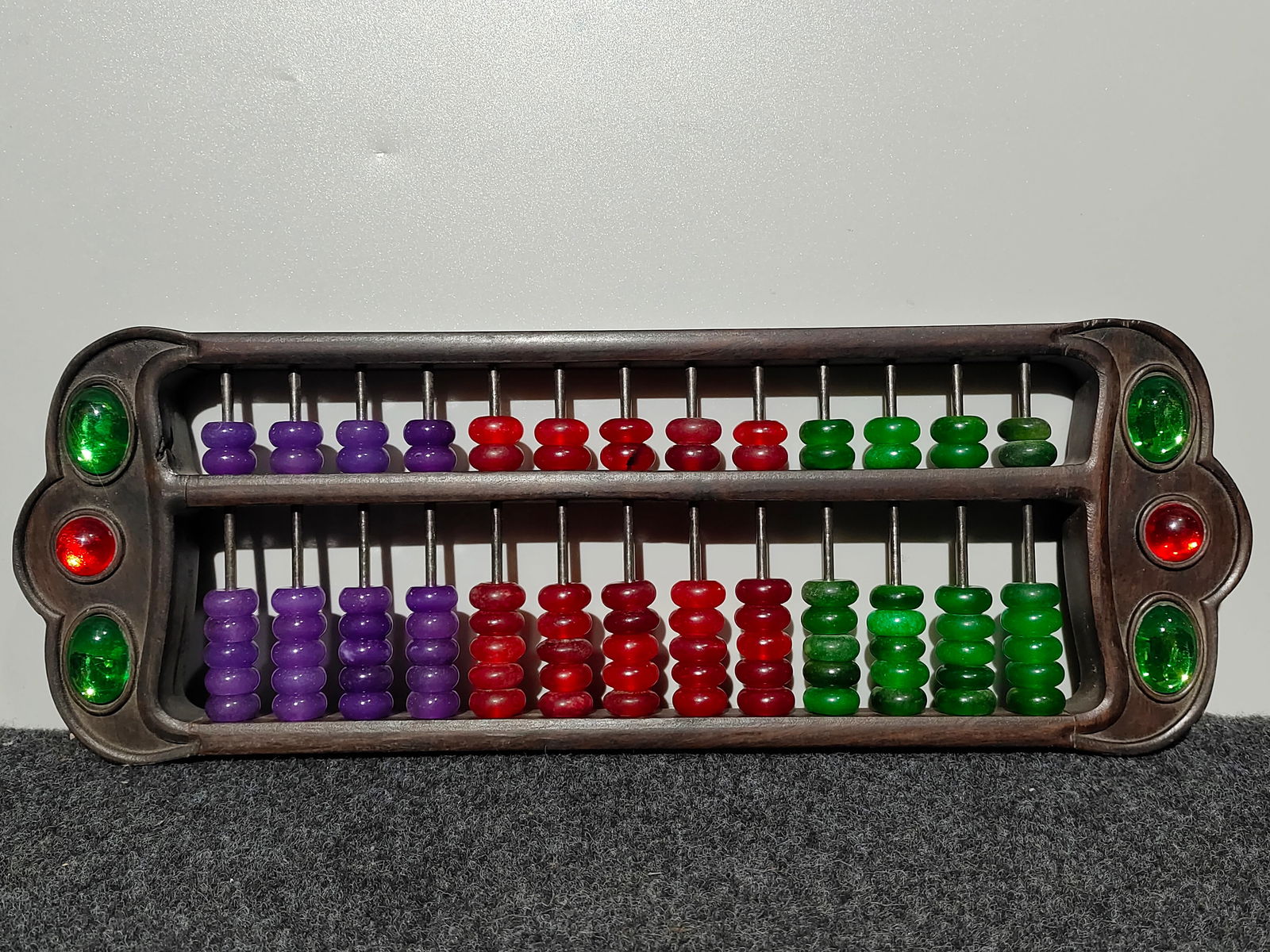 Old Collection Rosewood Seven-Color Jade Abacus: Old-collection rosewood abacus with seven-color jadeite, handmade and inlaid with gemstones, high-quality icy jadeite beads in purple, red, and green. Provenance:Private collection of the retired lawy