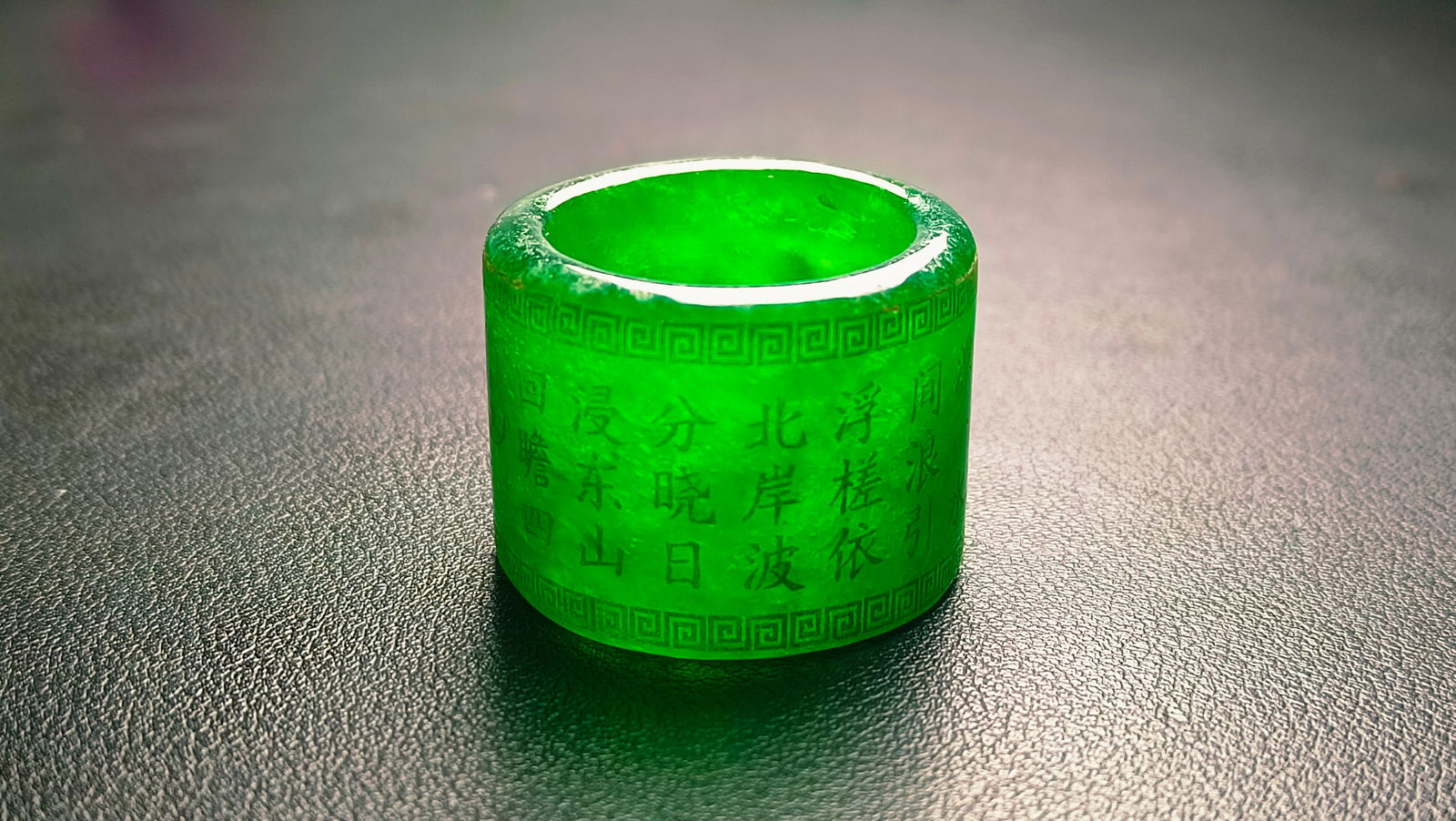 high-quality, icy imperial green jadeite thumb ring with an inscription. (1 of 8)