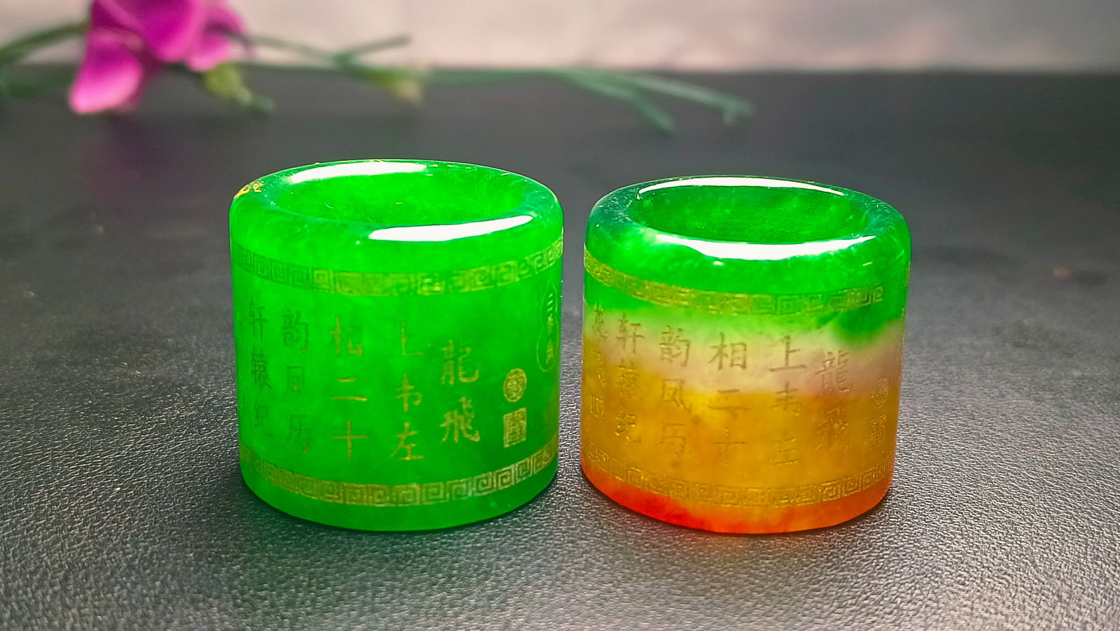 A pair of high-grade ice jadeite thumb rings with engravings. (1 of 8)