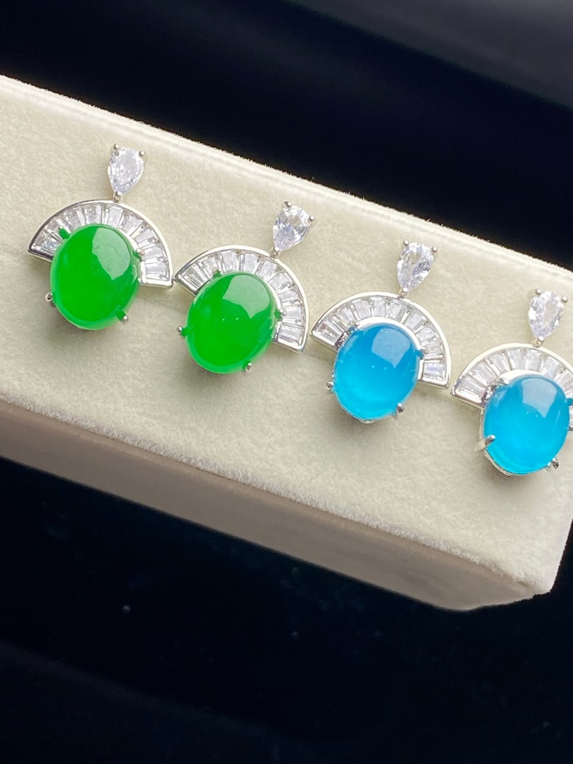 Jadeite of icy quality, full of green, blue-green "earrings": The jadeite earrings are of icy green quality, with a clear, translucent blue hue, exquisitely crafted, and perfectly flawless. Provenance:Private collection, Vancouver, Canada. Our dedicated team exp