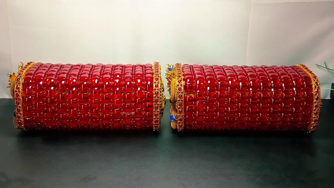 Gold-plated cloisonne dragon and phoenix auspicious ruby pillow: A pair of gold-plated cloisonne dragon and phoenix pillows with rubies, measuring 28 x 15 cm, with a firmness of 10 and a weight of 3450 g. Provenance:From a private collection in San Diego, Californi