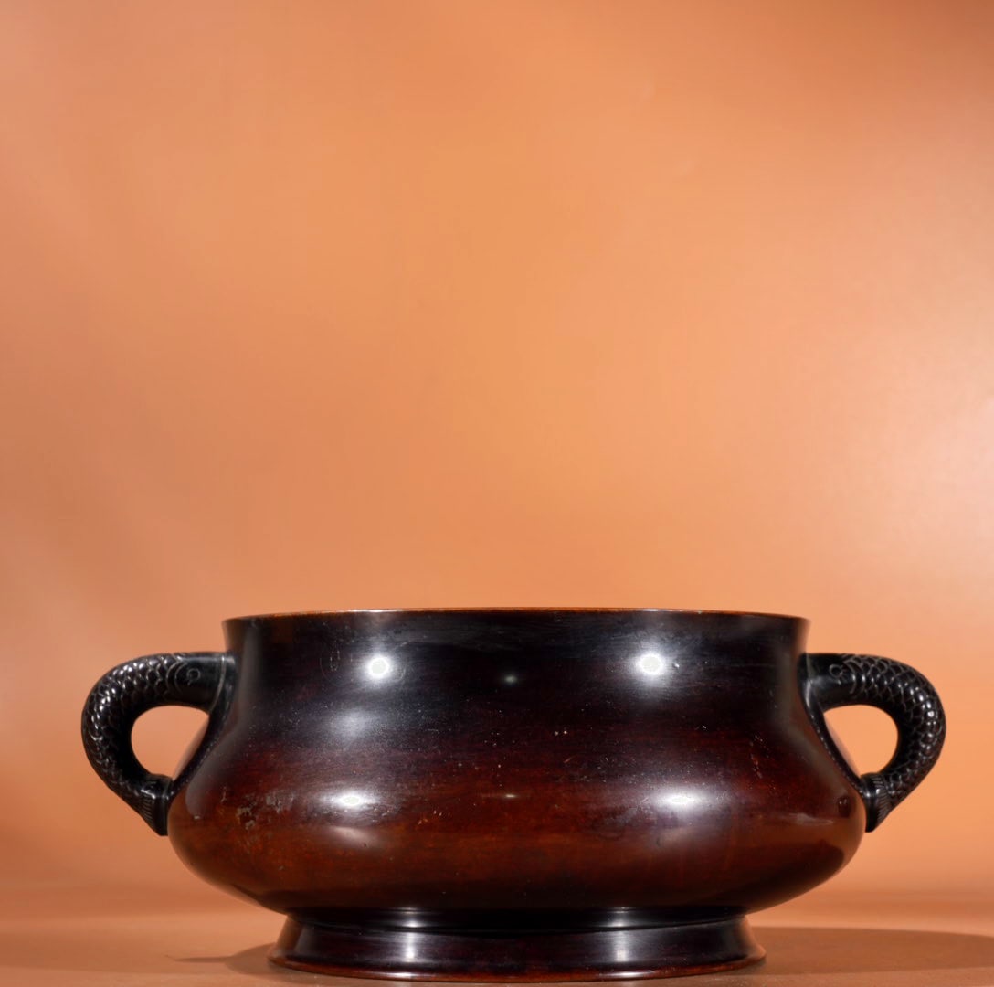 Purple Copper Fish Ear Incense Burner: A bronze fish-ear censer, 9.3 cm high, 16.3 cm in diameter at the mouth, and weighing 3665 grams. Provenance:Private collection, Vancouver, Canada. Our dedicated team expertly handles both domestic an