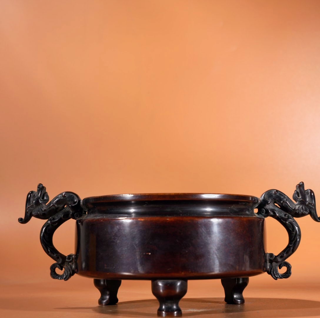 Purple Copper Animal Ear Incense Burner: A bronze incense burner with animal-shaped handles, 9.7 cm high, 13.6 cm in diameter at the mouth, and weighing 2385 grams. Provenance:Private collection, Cliffside Park, New Jersey. Our dedicated tea