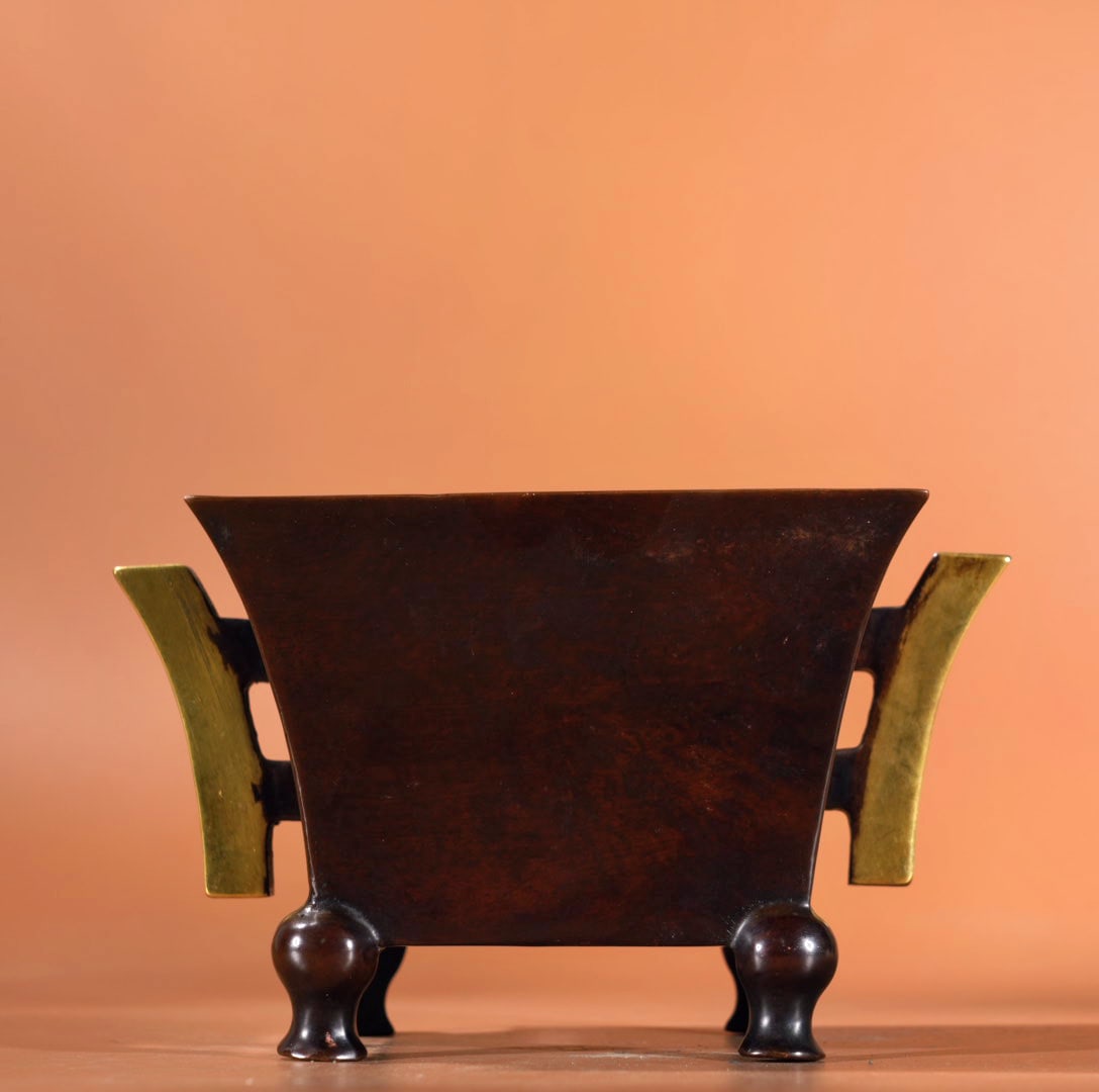 Gilded bronze square-eared censer: A gilt bronze square-eared censer, 10 cm high, 12.8 cm in diameter at the mouth, and weighing 1925 grams. Provenance:Mrs.Jennifer , Minneapolis, Minnesota. Collected by her late husband. Our dedicated