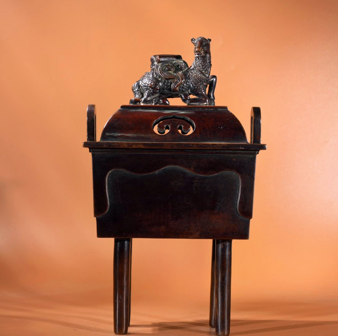 Purple copper square-eared incense burner: A bronze incense burner with square handles, 30.5 cm high, 18 cm and 12 cm in diameter at the mouth, weighing 4780 grams. Provenance:Mrs.Jennifer , Minneapolis, Minnesota. Collected by her late husban