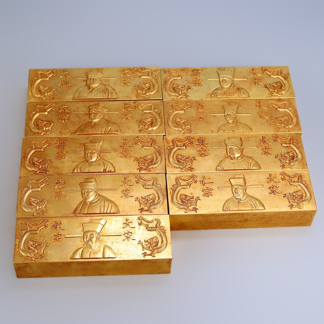 A set of rare, gilt-copper bricks, featuring relief engraving and solid, thick copper, in excellent (1 of 11)