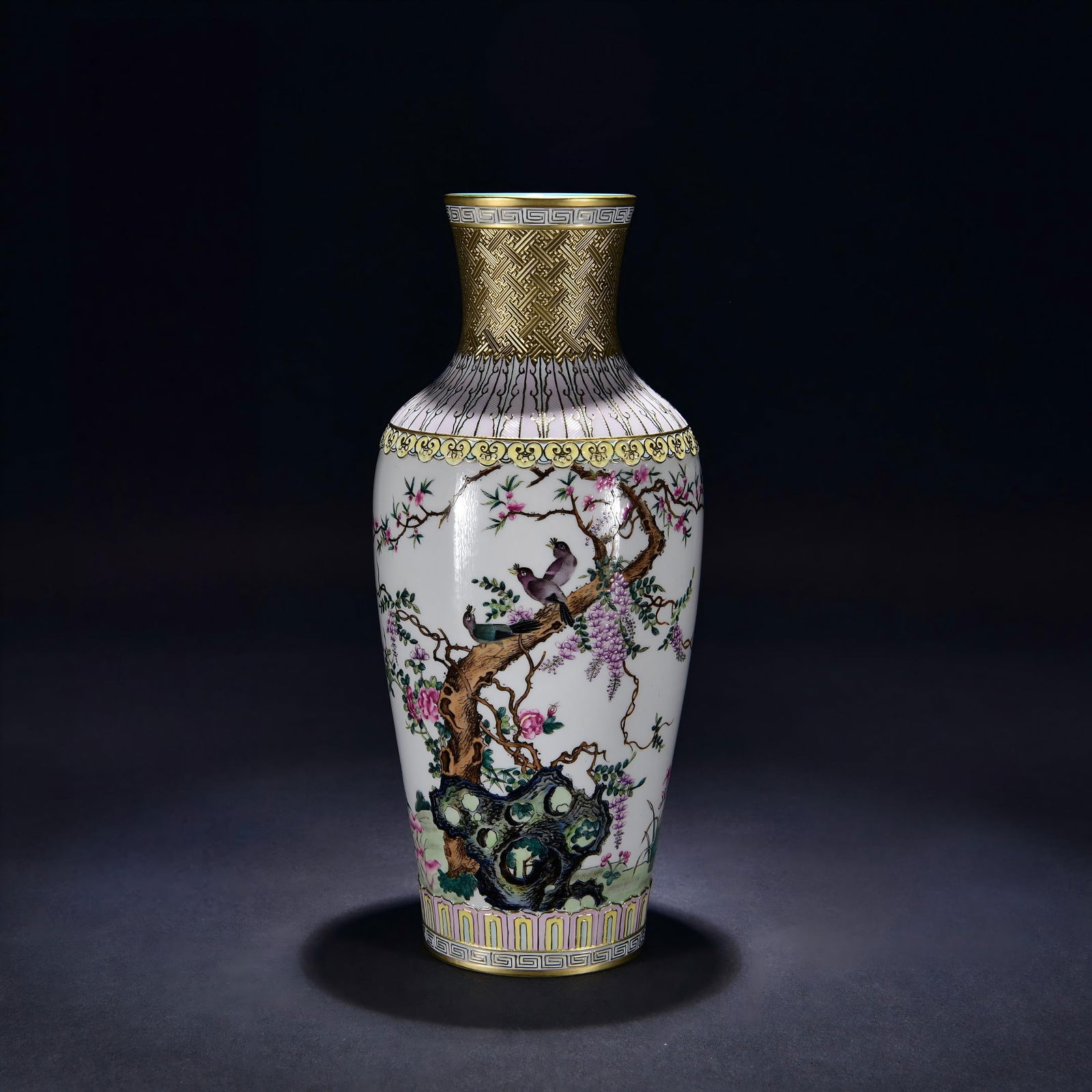 A Qing Dynasty Qianlong period carved gilt-enamel Guanyin vase with a design of purple clouds coming: A Qing Dynasty Qianlong period carved and gilt-enamel Guanyin vase with a design of purple clouds coming from the east, measuring 38 cm in height and 19 cm in width. Provenance:Private collection ,