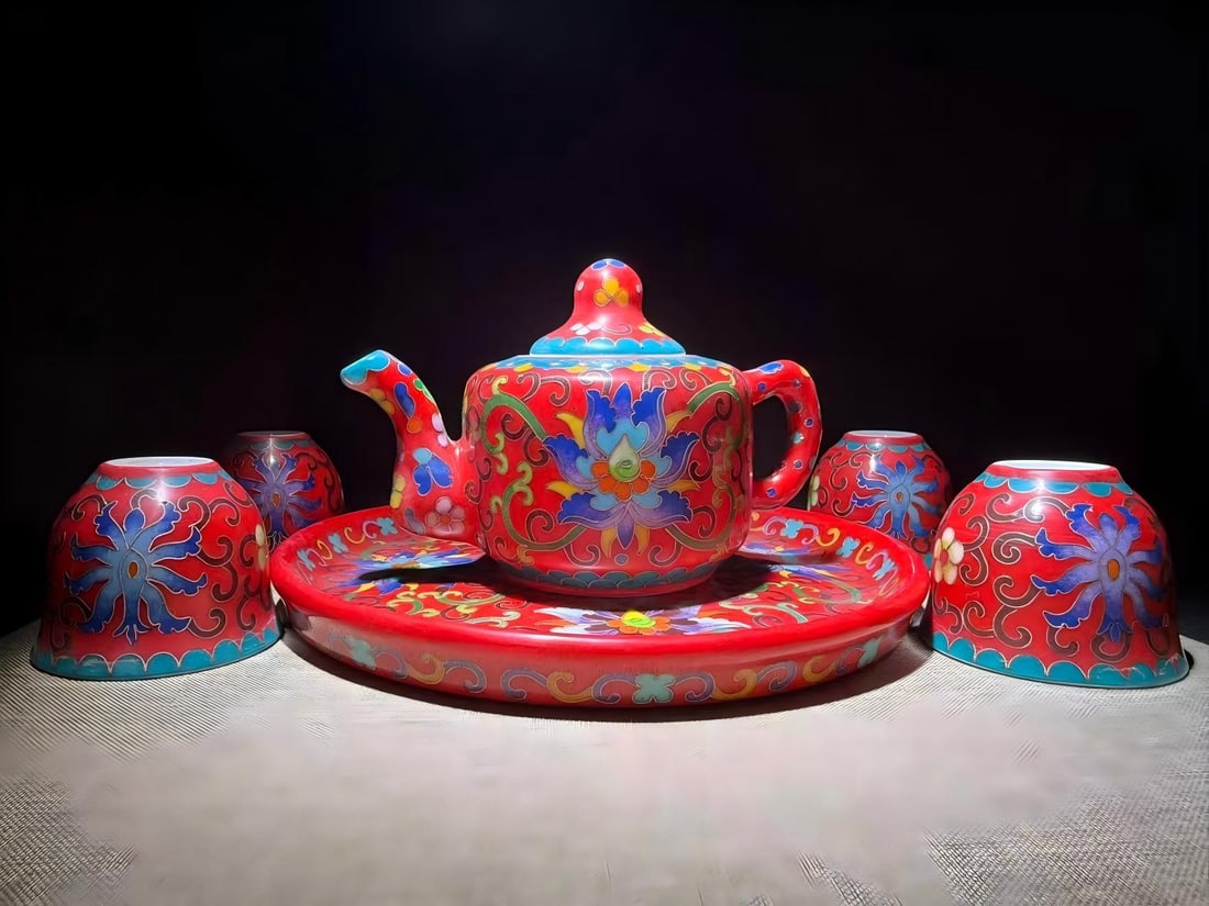 Ming Dynasty Chenghua period cloisonne enamel teapot: Five Ming Dynasty Chenghua period cloisonne enamel teapots, each measuring 11 x 16 cm in height, with a cup measuring 5.5 x 6.5 cm in height and a saucer measuring 21.5 cm in diameter.