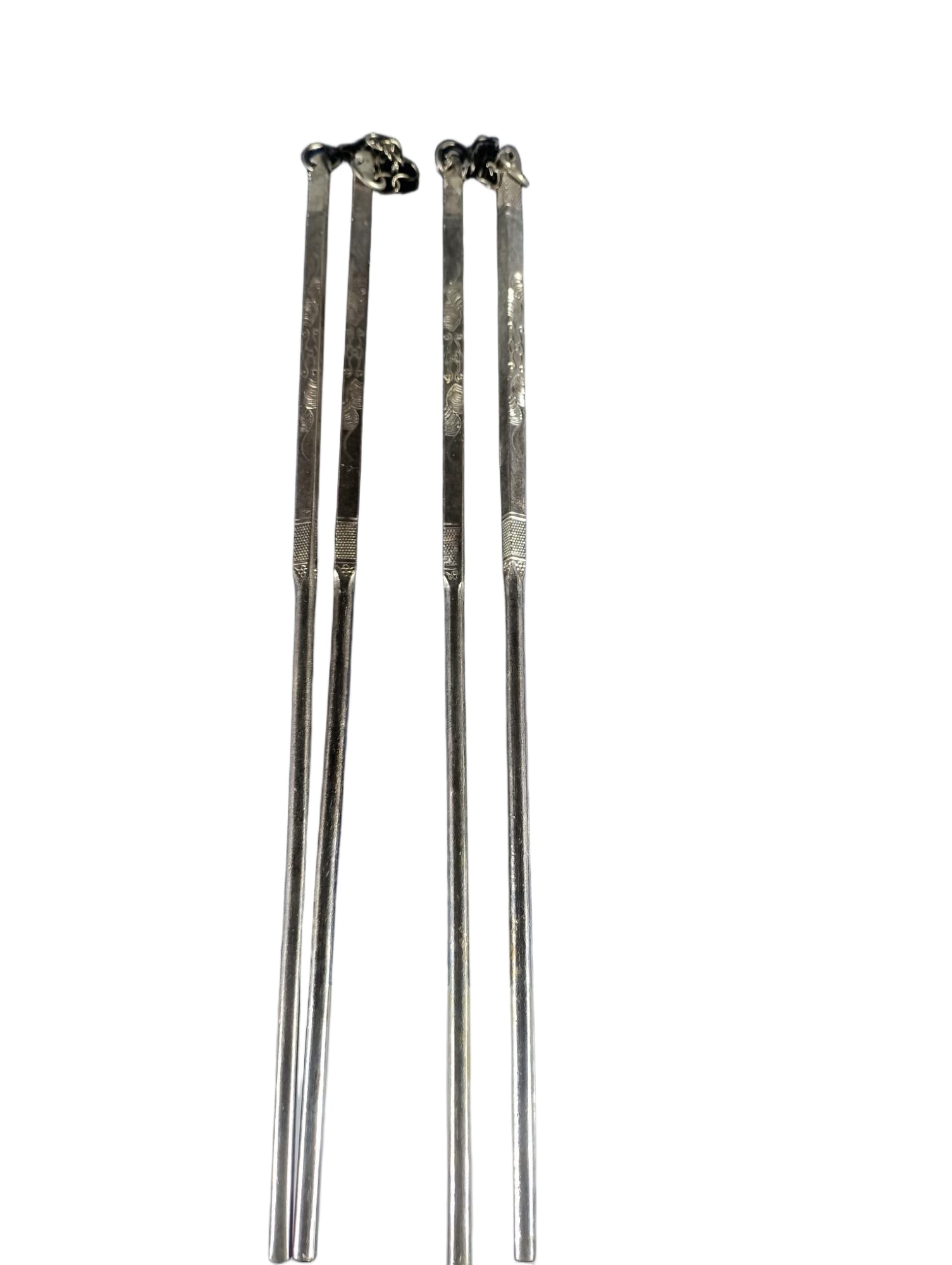 Sterling silver chopsticks: Two pairs of sterling silver chopsticks, exquisitely crafted, 21 cm long, and weighing 63 grams. Provenance:Private collection from a professor in Massachusetts Institute of Technology. Our dedicated