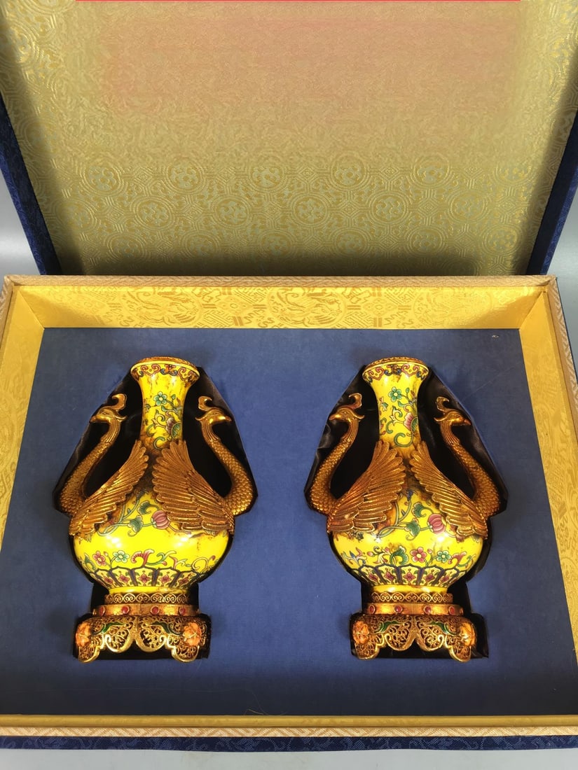 Cloisonne enamelware vase with golden ground and famille rose decoration, purely handmade.: This cloisonne enamel vase with a golden-yellow ground and famille rose decoration is purely handmade. The layout is well-balanced and clear, highlighting the theme and creating distinct layers. The f