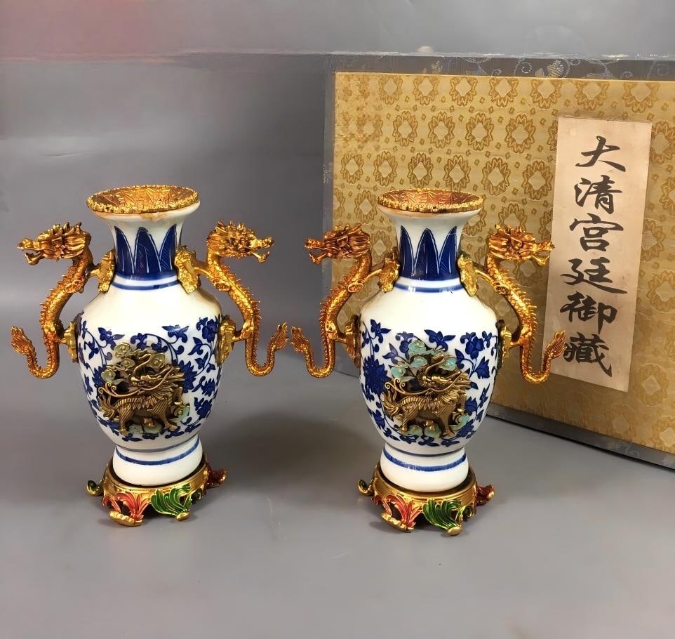 A rare Qing Dynasty Qianlong period cloisonne enamel and gold-plated blue and white lotus scroll: A rare collectible: a Qing Dynasty Qianlong period cloisonne enamel vase with gold overlay and blue and white lotus scroll design, 5x14x16cm. Provenance:Mr.Jordi, Northern Virginia. Our dedicated team