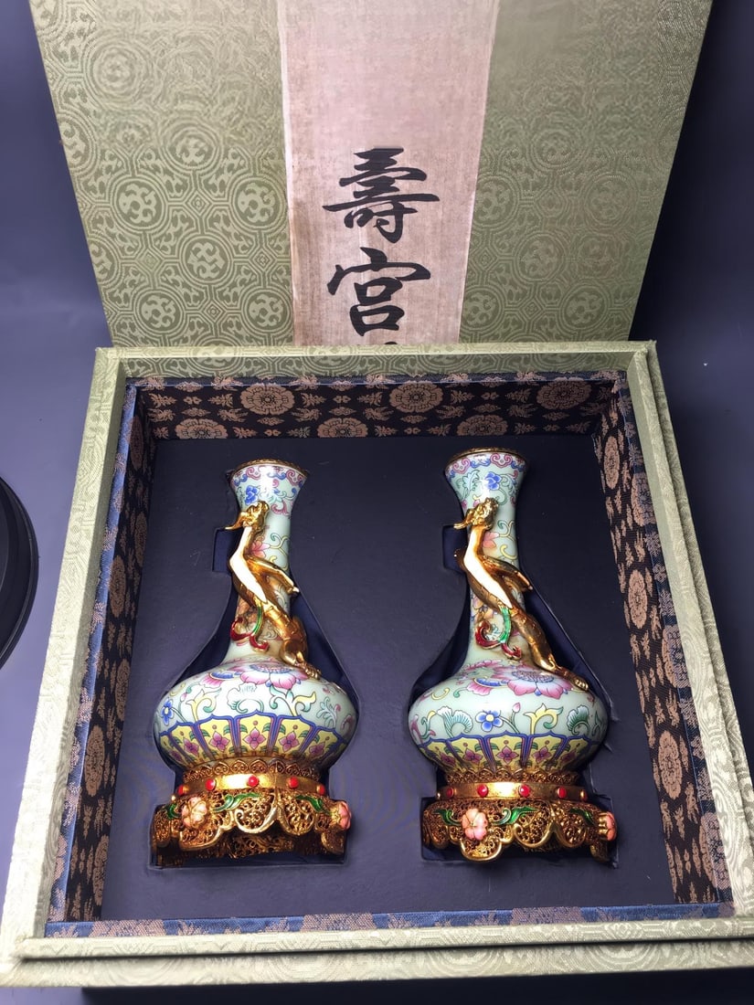 Qing Dynasty, Qianlong Period Cloisonne Enamel with Gold-Plated Floral Design Vase: A Qing Dynasty Qianlong period cloisonne enamel vase with gold-plated floral design, 4 x 8 x 17.5 cm Provenance:Mrs. Blair, Newport Beach, California. Our dedicated team expertly handles both domestic