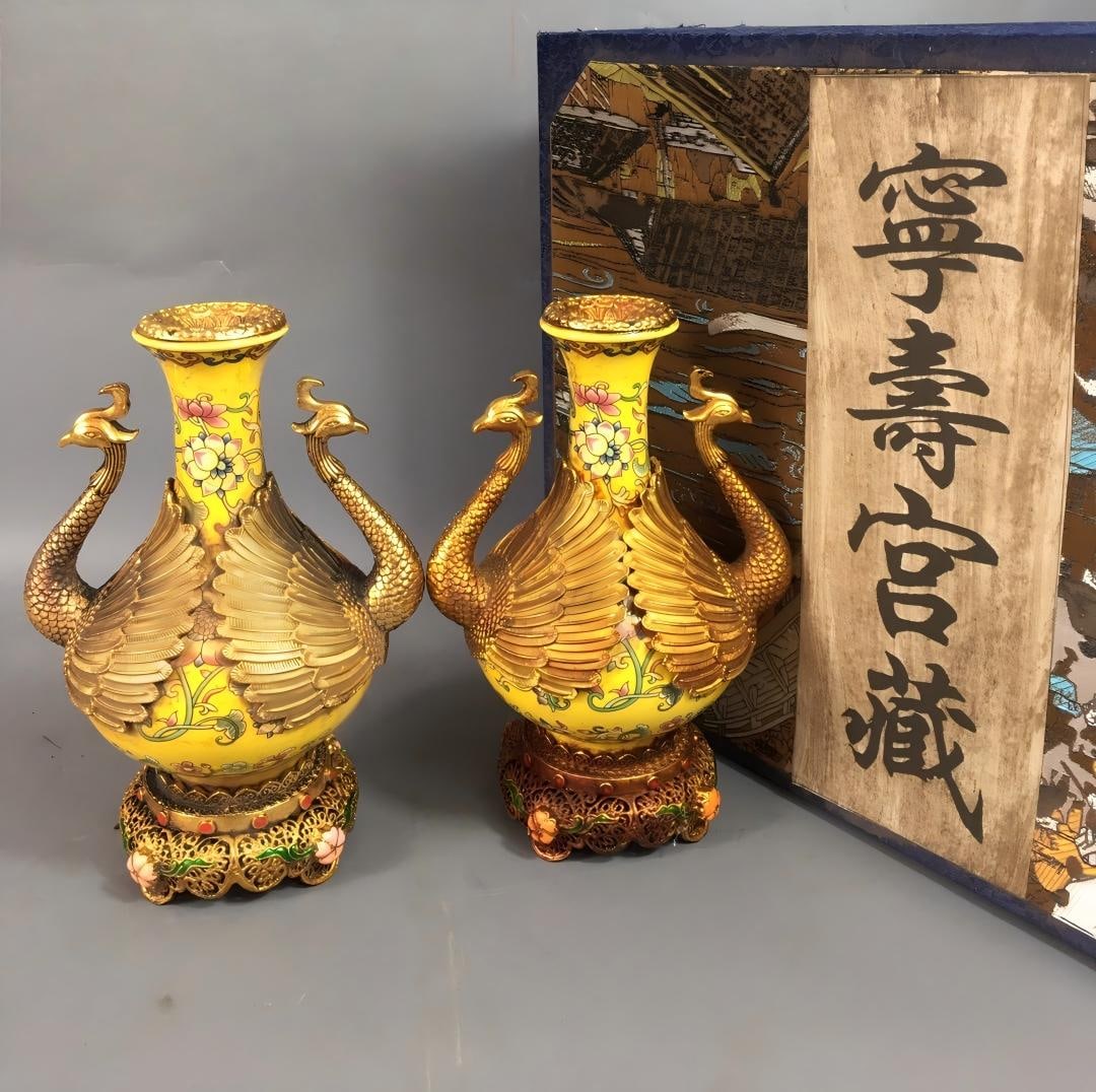 A rare Qing Dynasty cloisonne enamel vase with a gold-ground famille rose floral design.: A rare Qing Dynasty cloisonne enamel vase with a gold-ground famille rose floral design, measuring 4 x 11.5 x 17 cm. Provenance:Private Estate, Michigan. Our dedicated team expertly handles both domes