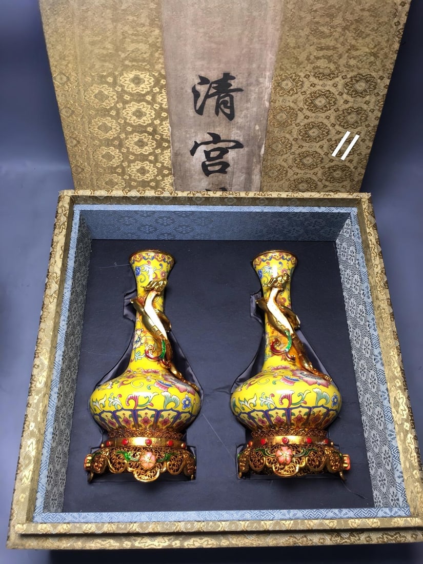 Qing Dynasty, Qianlong Period, Cloisonne Enamel Vase with Gold-Glazed Ground and Famille Rose Floral: A Qing Dynasty Qianlong period cloisonne vase with a gold-plated ground and famille rose floral design, measuring 4 x 8 x 17.5 cm. Provenance:Private Estate, Michigan. Our dedicated team expertly hand