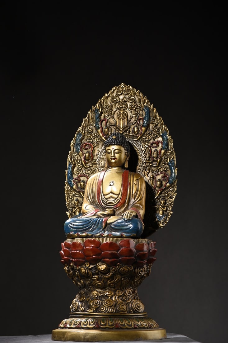 Copper-painted Shakyamuni Buddha statue: A bronze painted Shakyamuni Buddha statue, 36cm high, 16cm wide, and weighing 3235 grams. Provenance:Private collection, Connecticut. Our dedicated team expertly handles both domestic and global shipp