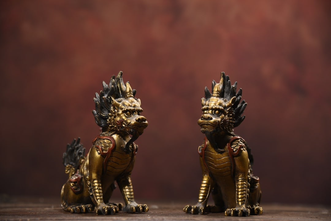 A pair of bronze painted Bi'an ornaments (1 of 9)