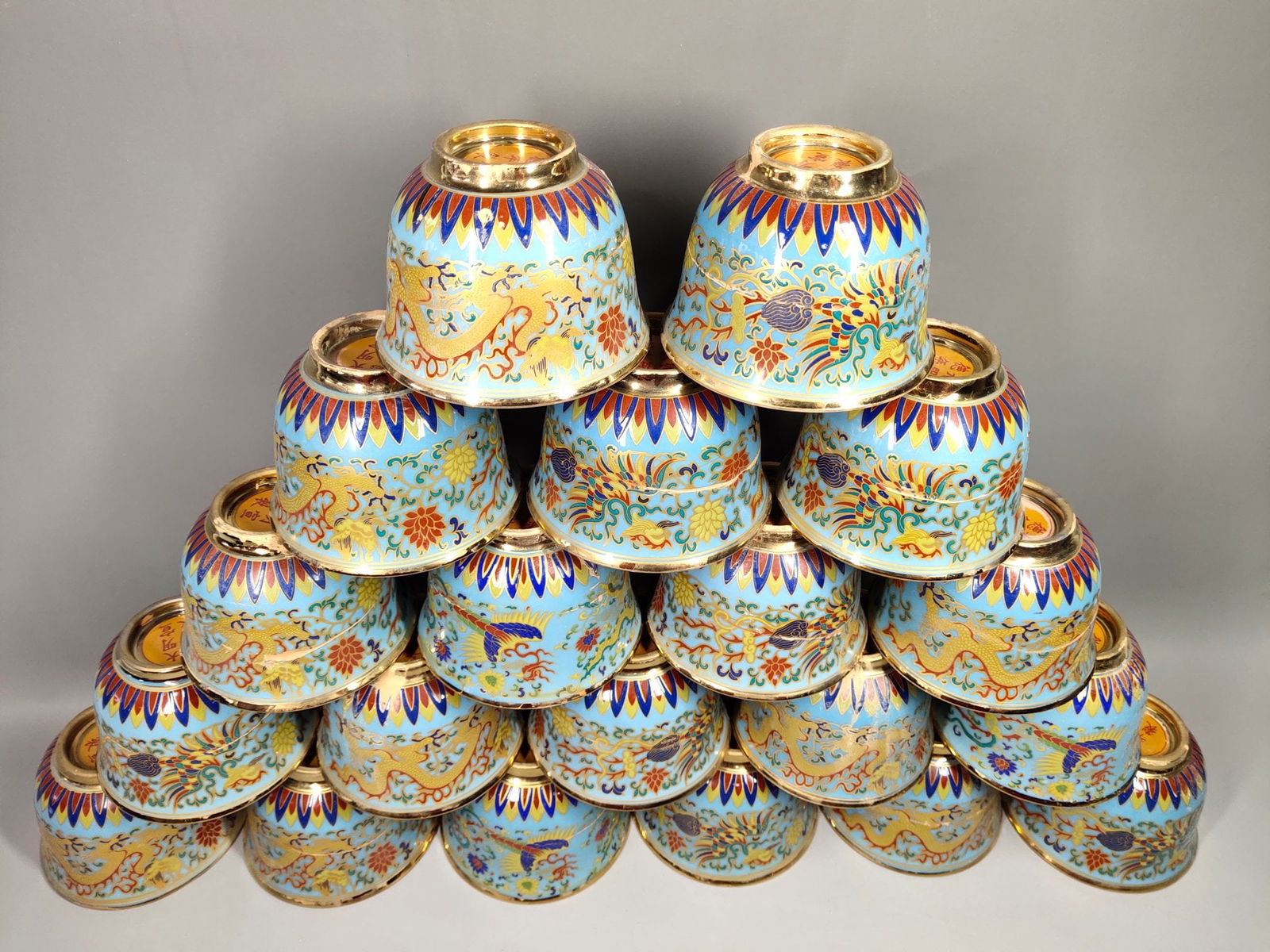 A treasured gilt dragon and phoenix patterned cup from the Xuande period.: Twenty gilt dragon and phoenix patterned cups made during the Xuande period, a treasured collection. Provenance:Mrs. Amily, Washington, DC. Our dedicated team expertly handles both domestic and global