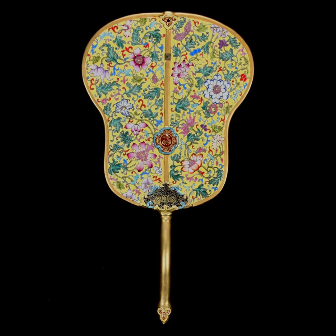 A Qianlong period enamel-gilt banana leaf fan with floral design: A Qing Dynasty Qianlong period enamel-gilt banana leaf fan with floral design, 42 cm high and 23 cm in diameter. Provenance:Private collection, Cliffside Park, New Jersey. Our dedicated team expertly