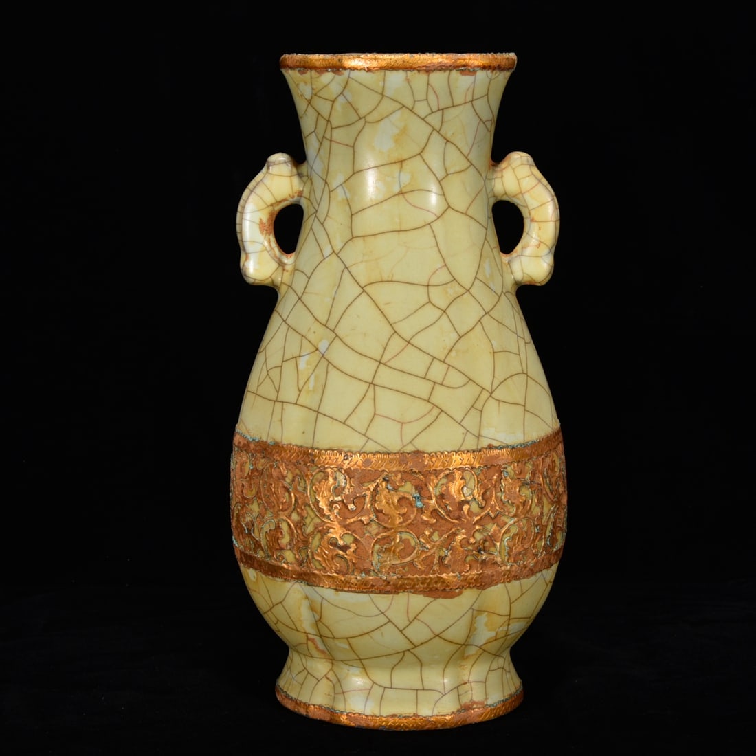 Song Dynasty official kiln double-eared vase with gilded mouth: A Song Dynasty official kiln vase with gilded handles and a rim, 29 cm high and 16 cm in diameter. Provenance:Private collection, Middletown, Rhode Island. Our dedicated team expertly handles both
