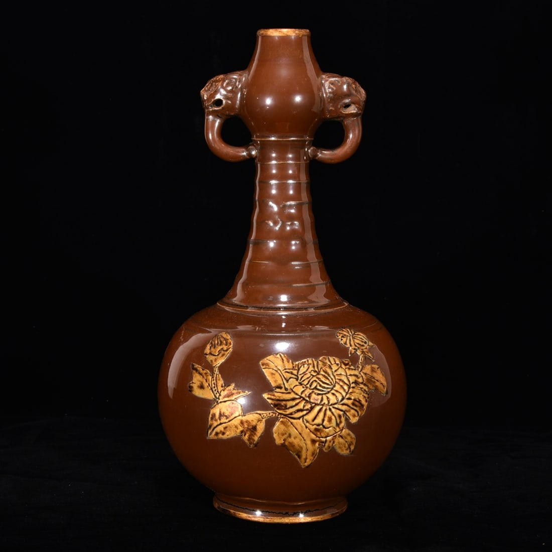 Song Dynasty Ding Ware Purple-Gold Glazed Double-Eared Vase with Garnet-Inlaid Mouth: A Song Dynasty Ding ware vase with a purple-gold glaze, a rim inlaid with gold, and two handles; 29 cm high and 15 cm in diameter. Provenance:Private collection, Middletown, Rhode Island. Our