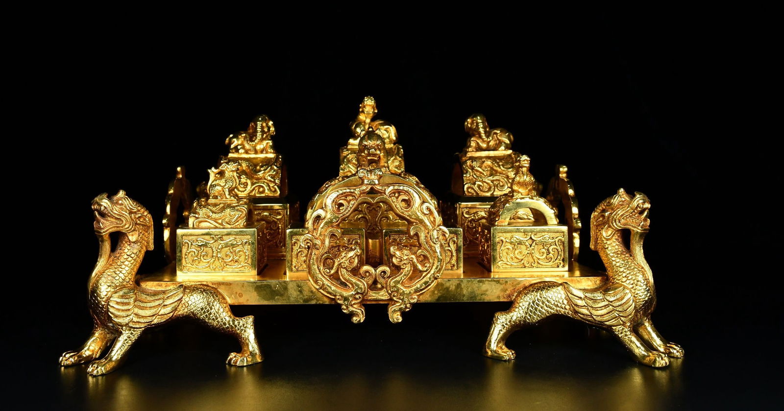 Gilded arched dragon seal from the Qing Dynasty: A Qing Dynasty gilded arched dragon seal, 18 cm high, 33 cm wide, 36 cm long, and weighing 23,600 g. Provenance:Private collection, Vancouver, Canada. Our dedicated team expertly handles both domestic