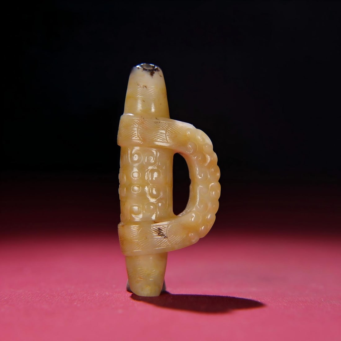 Exquisite antique, Hetian jade ingot-shaped pendant from a mature mine.: A finely crafted piece from a private collection, this Hetian jade ingot, carved in the style of a traditional Chinese coin, boasts a thick patina and deep, penetrating color. The craftsmanship is exq