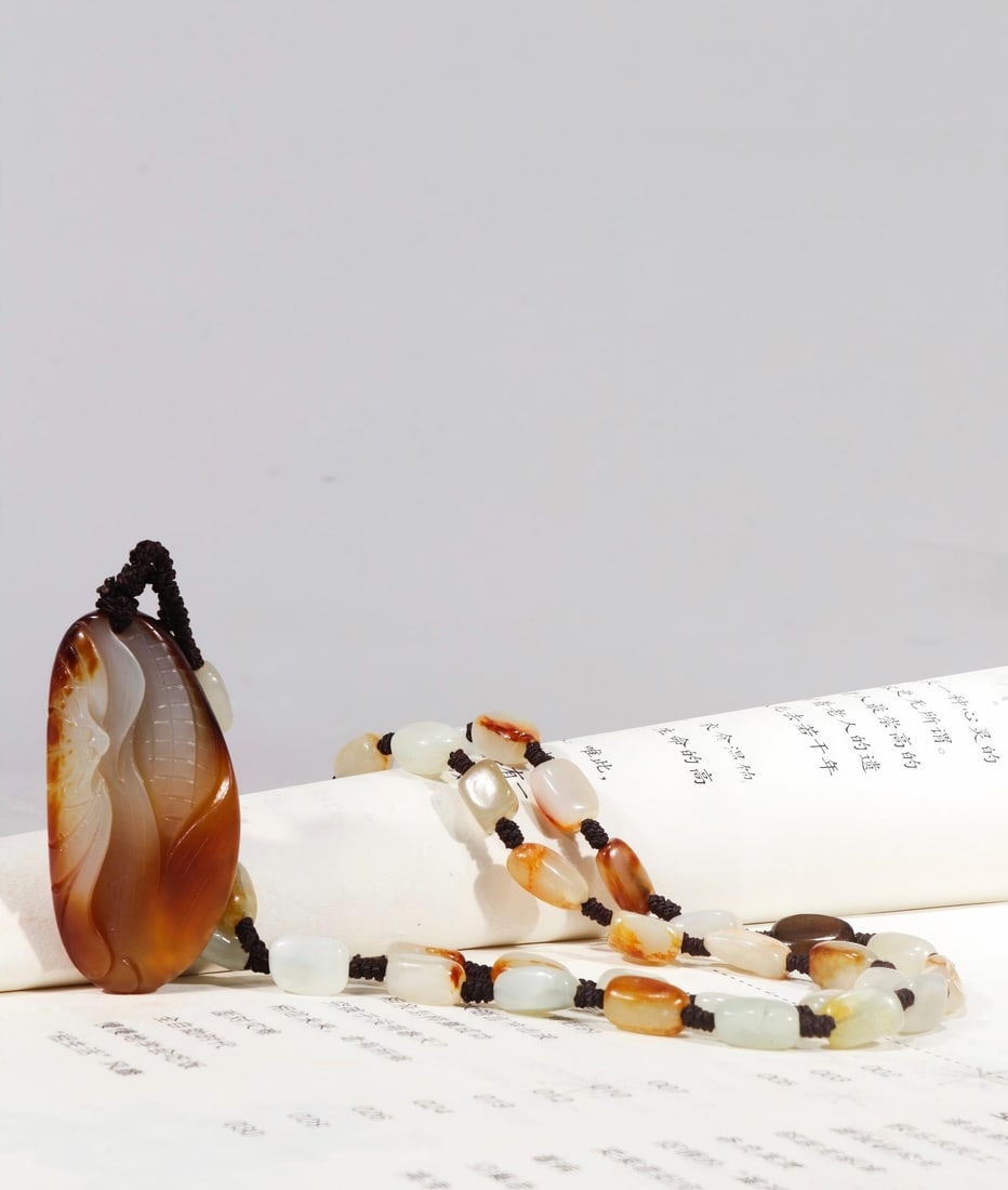 Old collection of pure natural Hetian jade pebble raw stone hand-carved 'Many Children and Many: This is a hand-carved pendant made from a piece of natural Hetian jade pebble, measuring 36cm in length, 5cm in height, and 2.5cm in width, and weighing 51.2g. Provenance:Private Estate, Michigan. Our