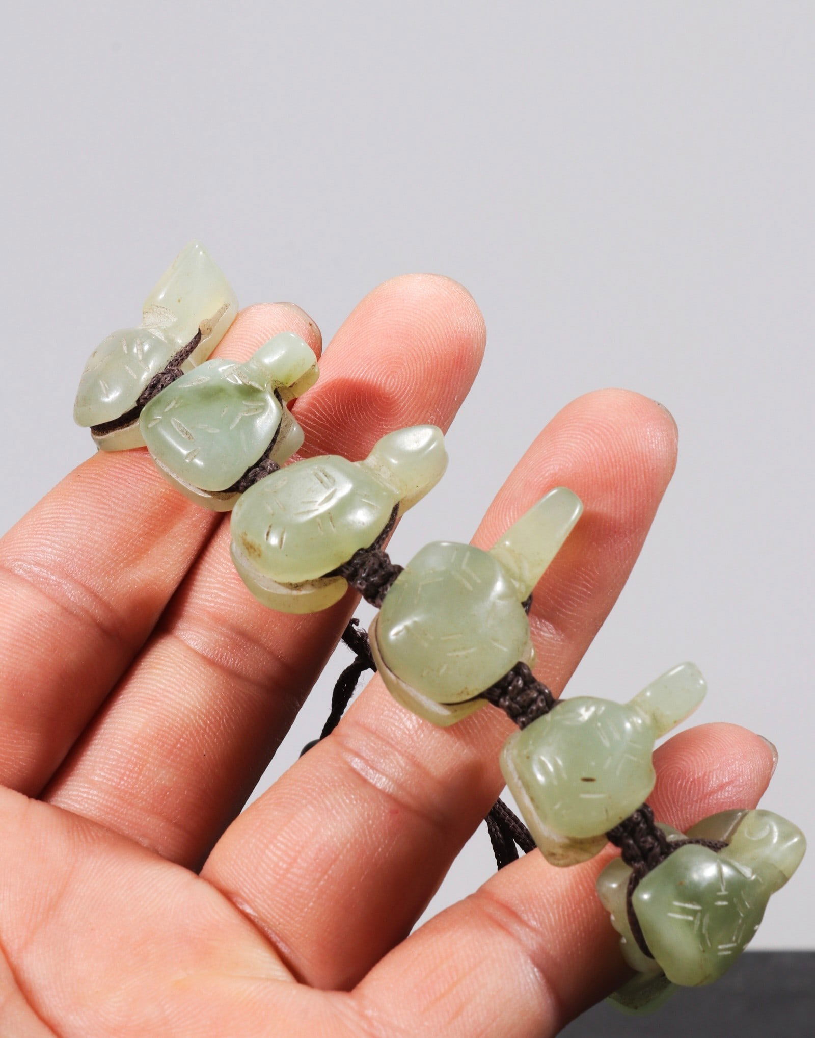 Old collection of hand-carved Hetian jade bracelet, symbolizing wealth and prosperity.: A hand-carved Hetian jade bracelet, formerly owned by an individual collector, measuring 2.0/1.7cm. Provenance:Private Estate, San Diego, California. Our dedicated team expertly handles both domestic