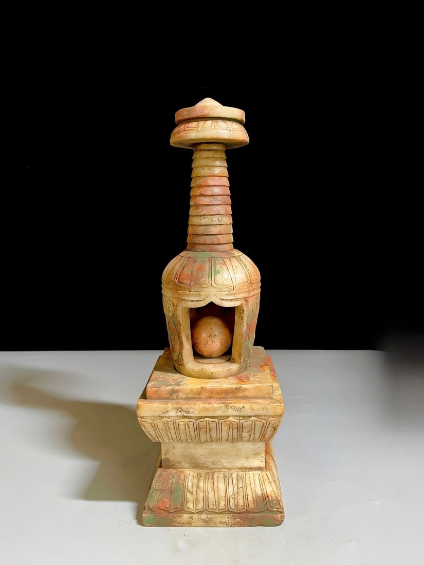 Hetian jade carving of Emperor Suzong of Tang, Li Heng's Buddhist stupa relic seal: The Hetian jade carving of Emperor Suzong of Tang's (Li Heng) Buddhist relic seal is 357cm tall and weighs 4.7kg. Provenance:Private collection, Quincy, Massachusetts. Our dedicated team expertly hand