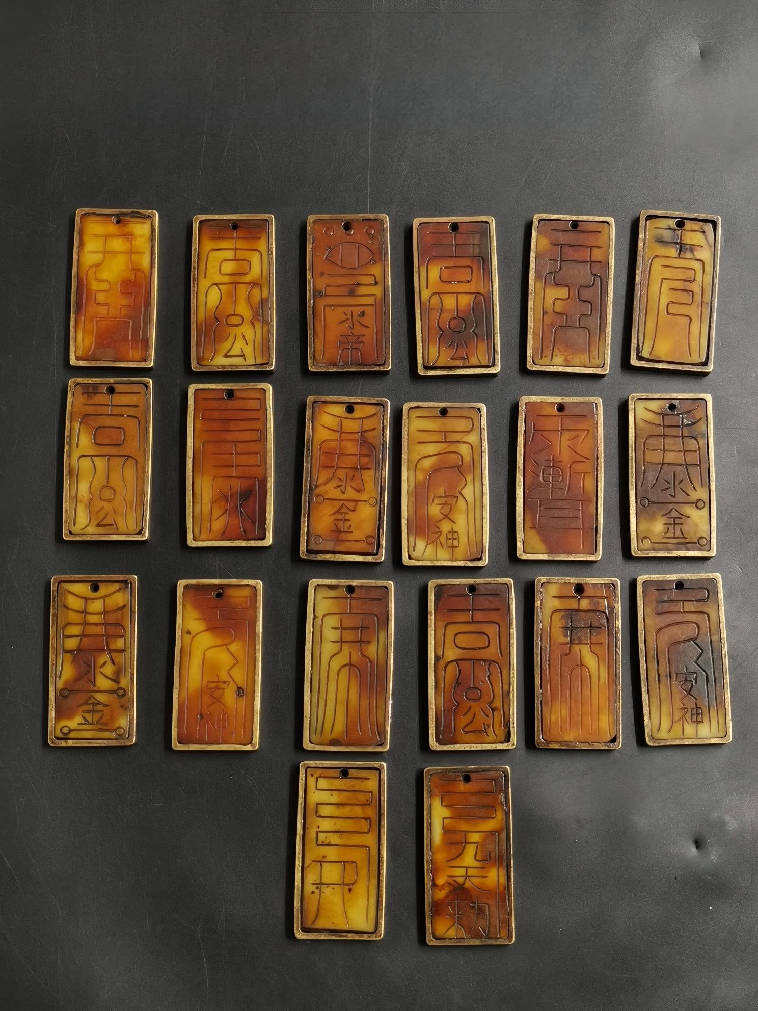 Old Hetian jade plaque with copper inscription featuring Taoist talismans: This old Hetian jade pendant with copper edging and Taoist talisman inscription measures 5cm in length, 2.5cm in width, and 0.4cm in thickness, weighing a total of 441.2g. The jade is warm and lustrou