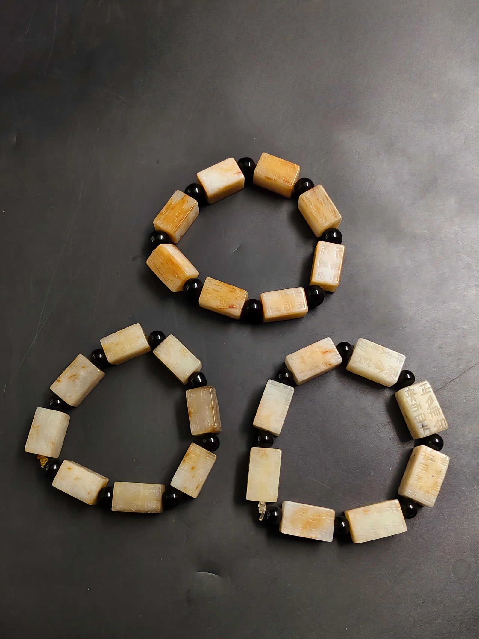 Ancient Jade Gangmao Bracelet: This ancient jade Gangmao bracelet weighs a total of 197.9g. Gangmao, a popular auspicious ornament in the Han Dynasty, is engraved with characters for warding off evil and praying for blessings, carr