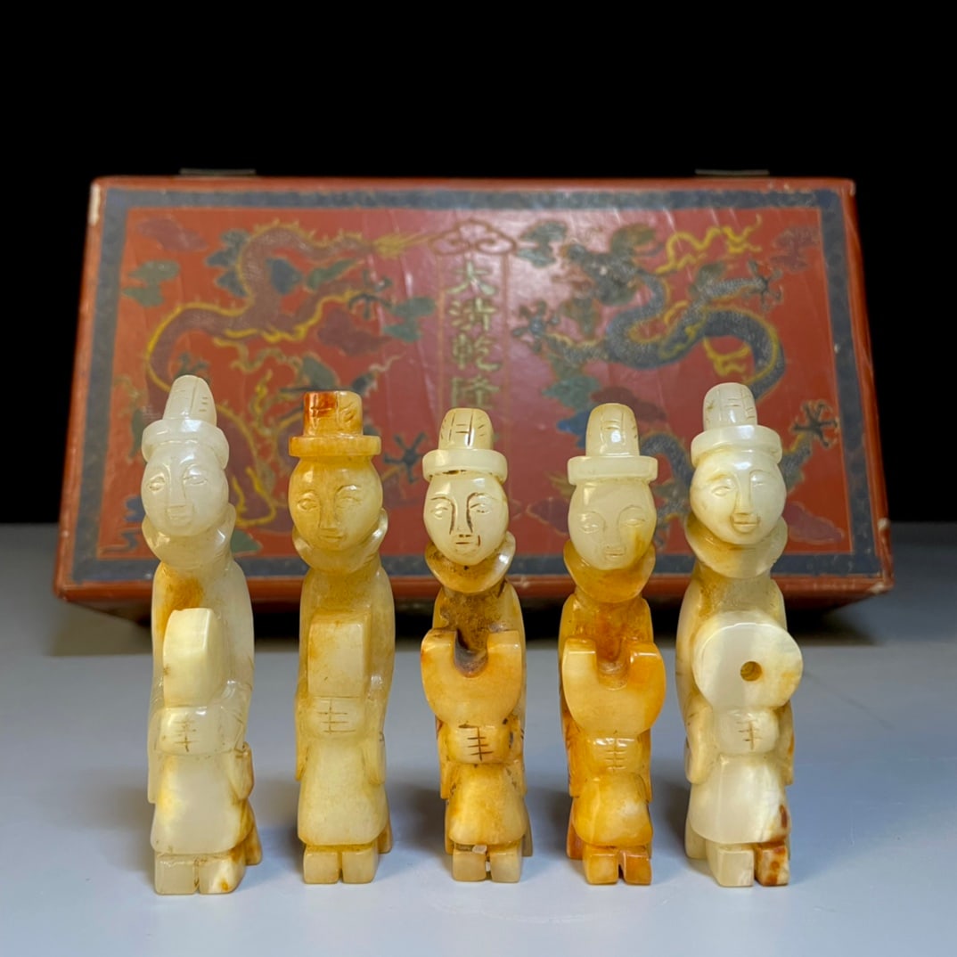 A box of precious Hetian jade.: A box containing rare Hetian jade "Nobleman" shaped stones, approximately 9 x 2.3 cm in size, weighing 245g. Provenance:Private collection of the retired lawyer Mr.Henry, Chelmsford, Massachusetts. Ou