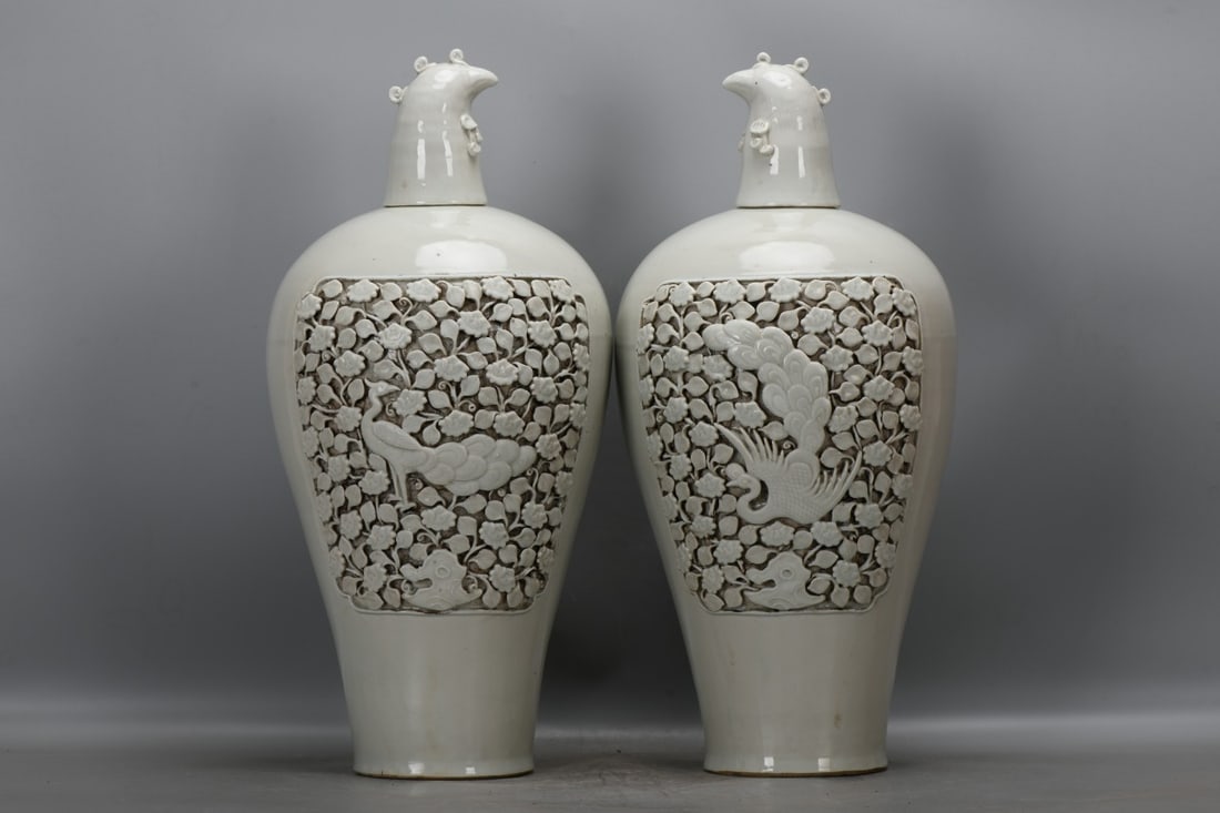 A pair of Yuan Dynasty sweet white porcelain vases with peacock and lotus floral designs and (1 of 9)