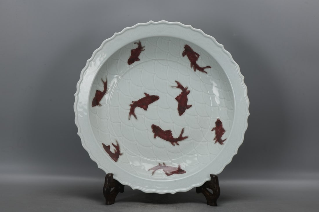 Yuan Dynasty, a plate with underglaze red carving of sea and fish patterns. (1 of 9)