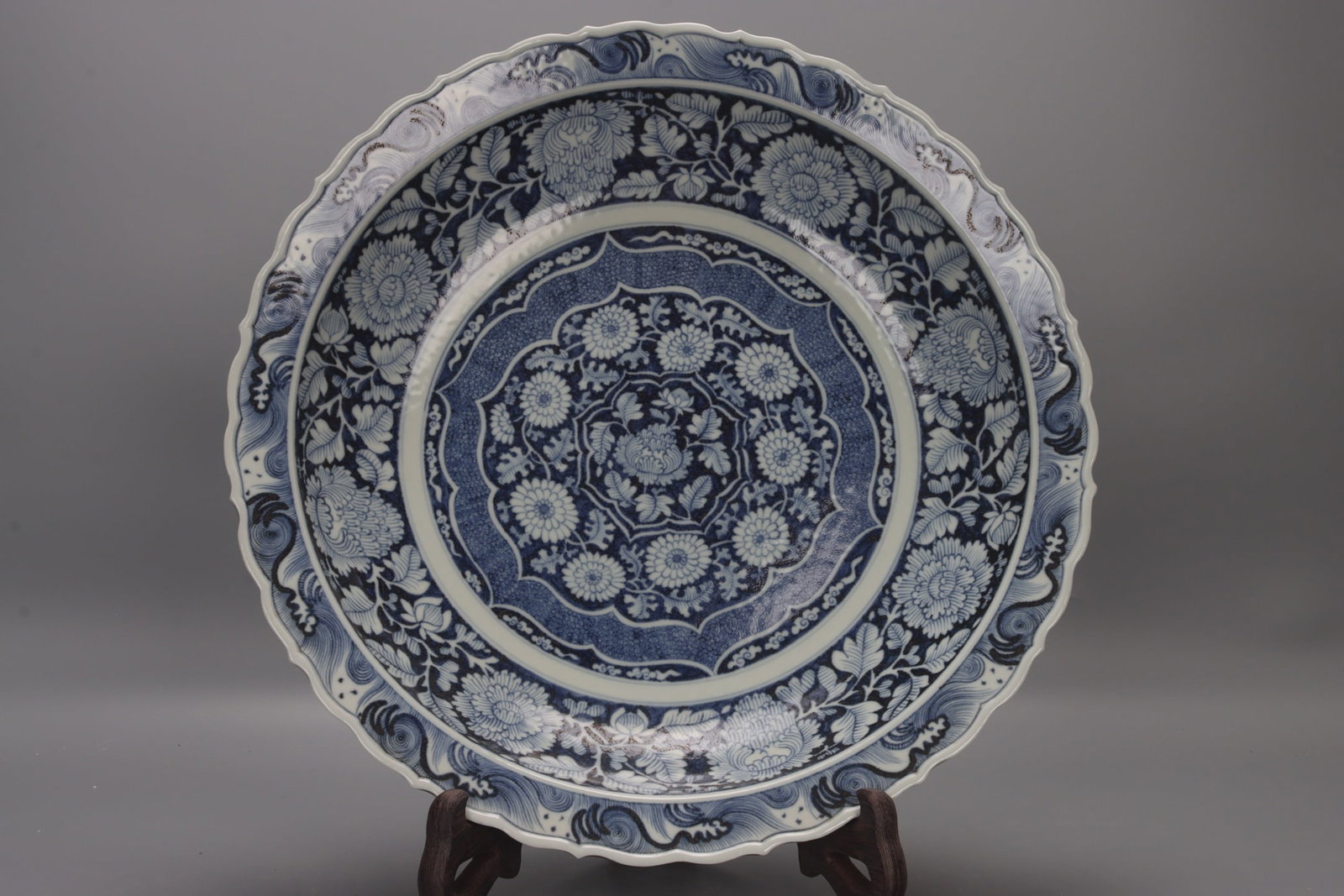 A Yuan Dynasty blue and white porcelain plate with lotus and seascape designs. (1 of 9)