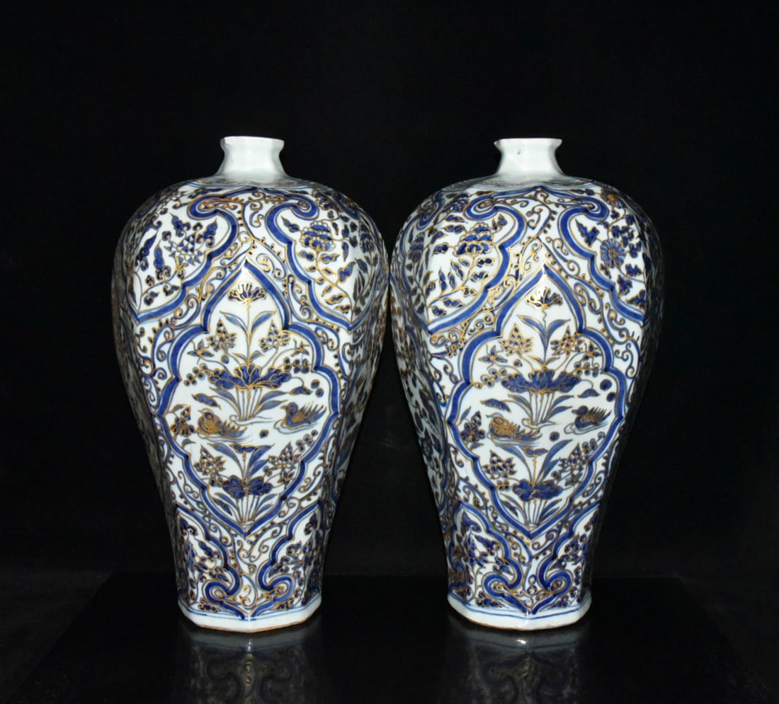 A pair of Yuan Dynasty Baihu Guyao blue and white gilt-painted mandarin duck and floral octagonal: A pair of Yuan Dynasty Baihu Guyao blue and white porcelain octagonal plum vases with gold-painted mandarin duck and floral designs, 44.5??26cm Provenance:Mrs. Amily, Washington, DC. Our dedicated tea