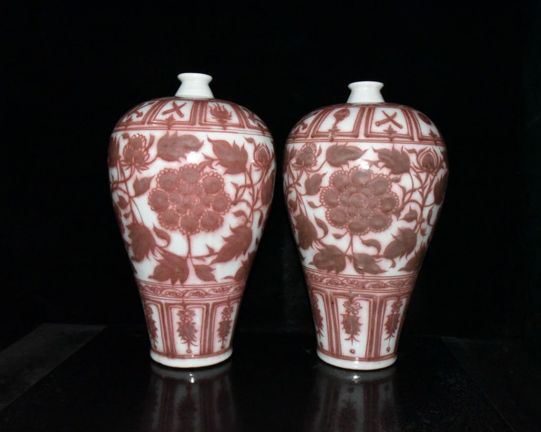 A pair of Yuan Dynasty Baihu Guyao underglaze red plum vases with intertwined floral patterns (1 of 9)