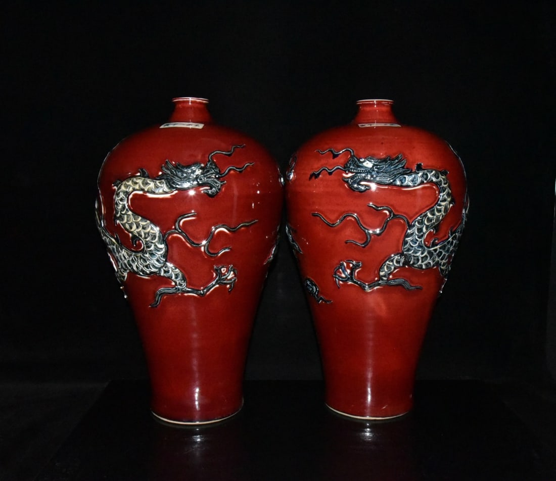 A pair of Yuan Dynasty red-glazed plum vases with relief dragon design (1 of 9)