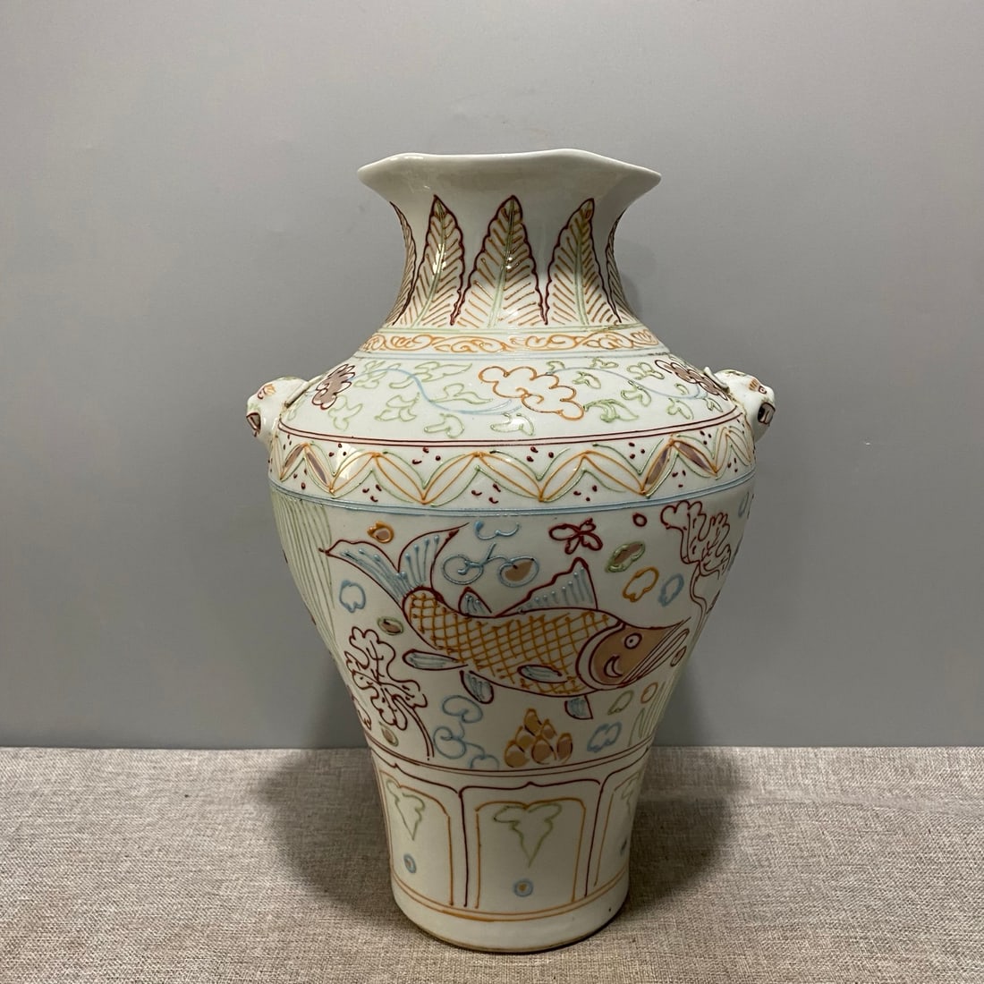 Yuan Dynasty Fish and Animal Head Flower-Shaped Bottle with Powdered Fish and Animal Head Design (1 of 8)