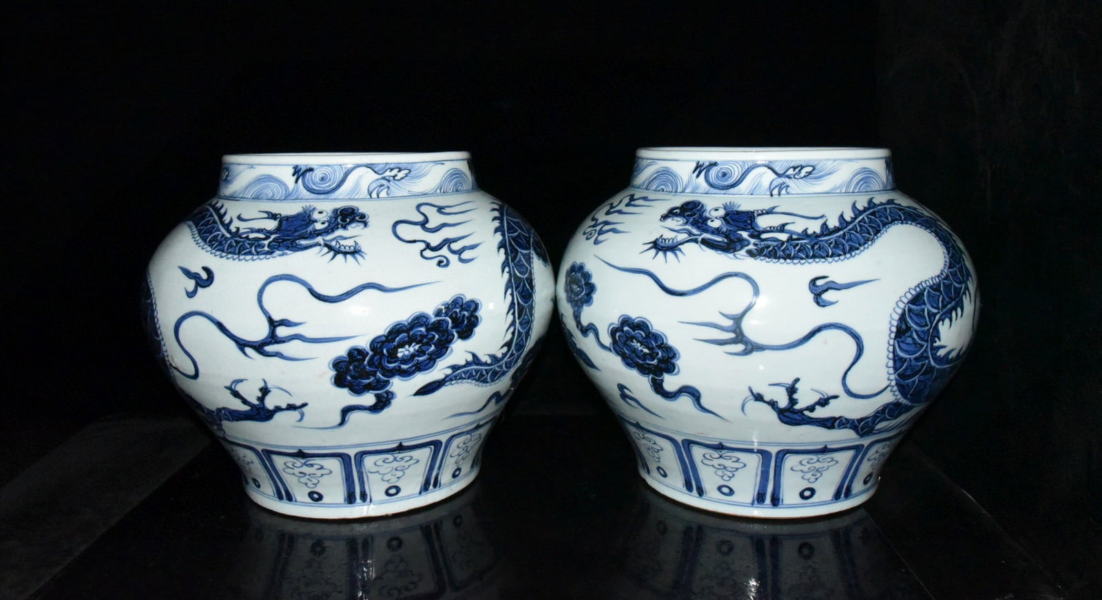 A pair of Yuan Dynasty blue and white dragon-patterned jars: A pair of Yuan Dynasty blue and white dragon-patterned jars, 29 x 36 cm Provenance:Private collection, Cliffside Park, New Jersey. Our dedicated team expertly handles both domestic and global shipping