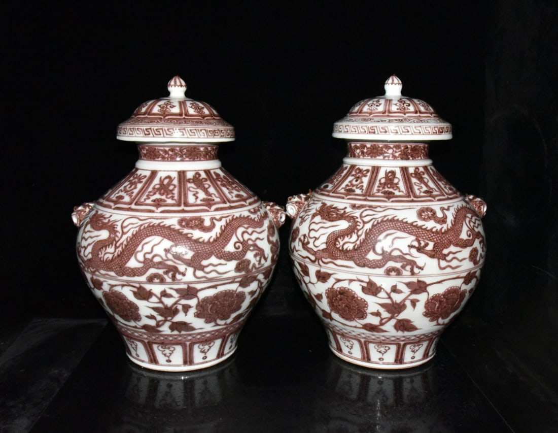 A pair of Yuan Dynasty underglaze red dragon and tiger head covered jars (1 of 9)