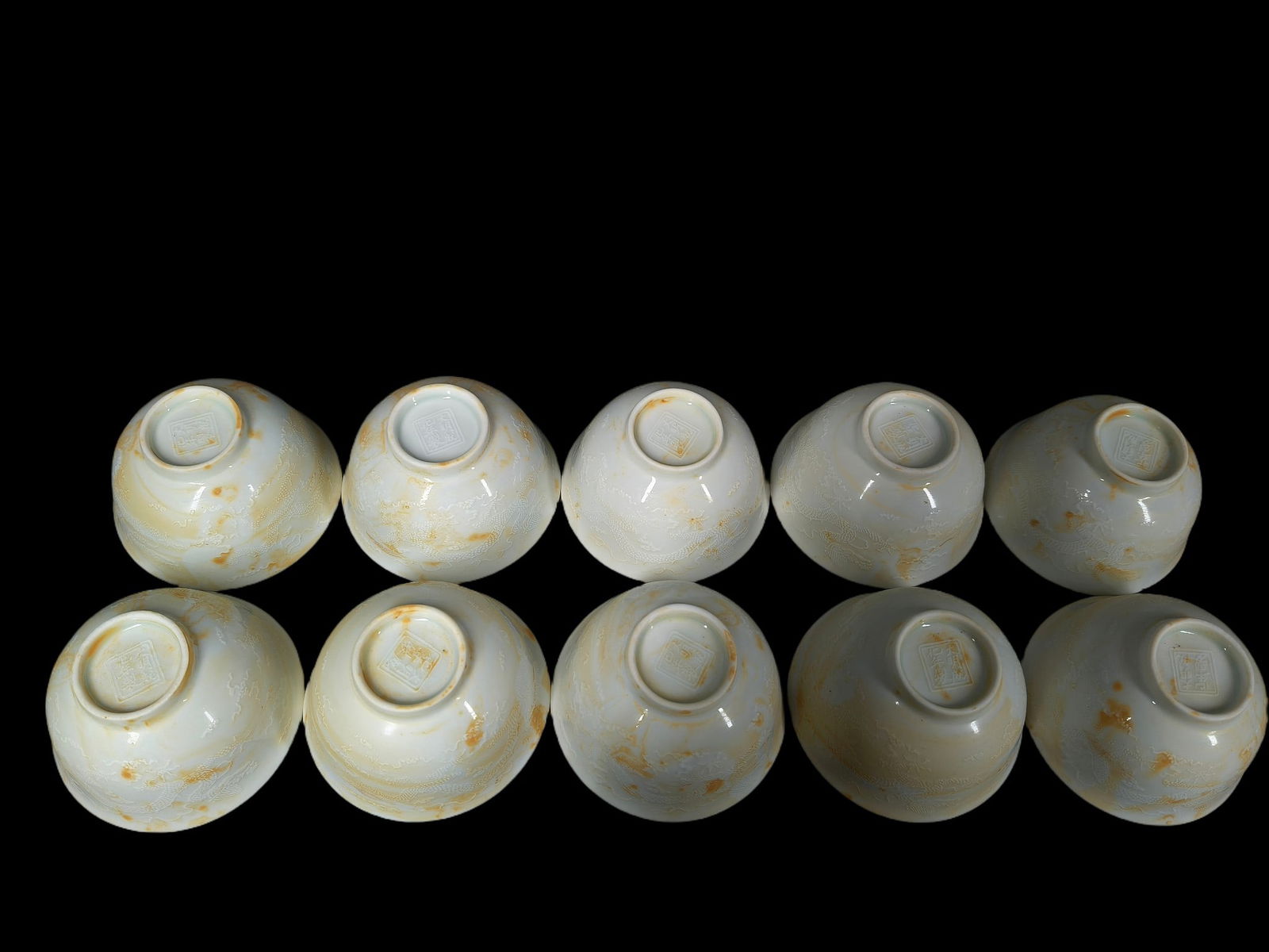 Ming Dynasty Chenghua Period Thin-bodied White Glazed Tea Cup with Double Dragon Design: Ten teacups with a thin-walled white glaze and double dragon design, made during the Chenghua period of the Ming Dynasty. Diameter: 8.2 cm; Height: 4.6 cm. Provenance:Private collection, Vancouver, Ca