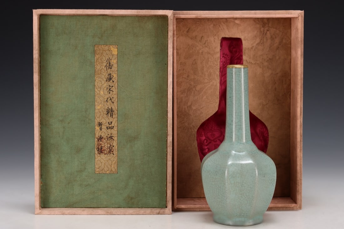 Formerly in the collection of an octagonal long-necked Ru ware vase from the Song Dynasty: A Song Dynasty Ru ware octagonal long-necked vase, formerly in the collection. Dimensions: Height: 20.2 cm; Diameter of belly: 9.7 cm. Provenance:Private collection from a professor in Yale University