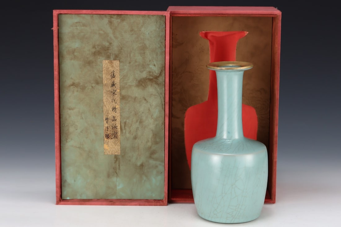 Formerly in the collection of a Song Dynasty Ru ware sky-blue glazed mallet-shaped vase: A Song Dynasty Ru ware sky-blue glazed mallet-shaped vase, formerly in the collection. Dimensions: Height: 26.7 cm; Diameter: 13.5 cm. Provenance:Mr. Stefan, Minneapolis, Minnesota. Our dedicated team