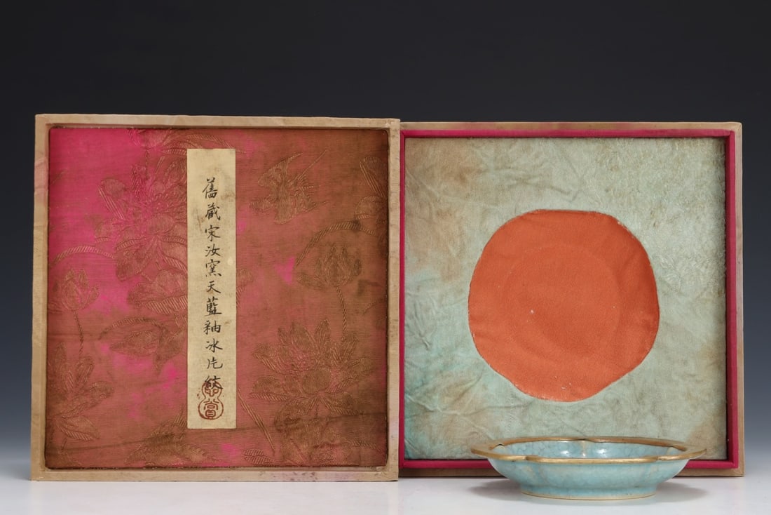 Formerly in the collection of a Song Dynasty Ru ware sky-blue glazed flower-shaped plate: A Song Dynasty Ru ware sky-blue glazed flower-shaped dish, formerly in the collection. Dimensions: Height: 2.2 cm; Diameter: 13.5 cm. Provenance:Mr. Jacob, Maryland. Inherited from his father. Our ded